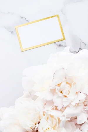 Glamorous business card or invitation mockup and bouquet of peony flowers, wedding and event branding designの写真素材