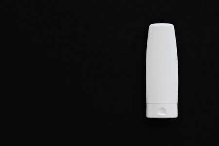 Blank label cosmetic container bottle as product mockup on black background, hygiene and healthcareの写真素材