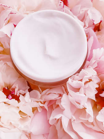 Face cream moisturizer on floral background as luxury skincare cosmetics, healthcare and beauty product conceptの写真素材