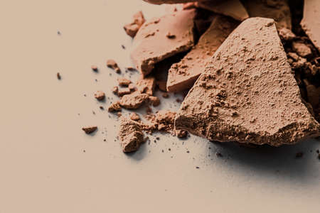 Beige eye shadow powder as makeup palette closeup, crushed cosmetics and beauty texturesの写真素材