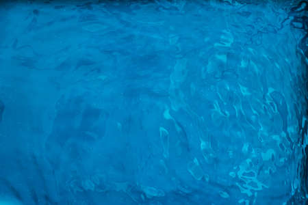 Blue water texture as abstract background, swimming pool and waves designsの写真素材