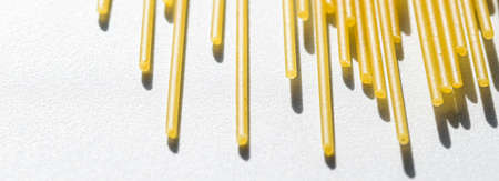 Uncooked whole grain spaghetti closeup, italian pasta as organic food ingredient, macro product and...