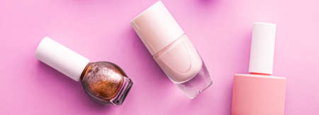 Nail polish bottles on pink background, beauty brandingの写真素材