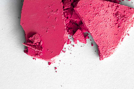 Pink eye shadow powder as makeup palette closeup isolated on white background, crushed cosmetics and beauty texturesの写真素材
