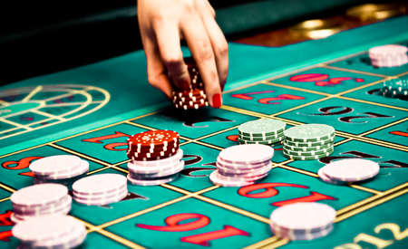 Betting and playing roulette in casino, gambling adsの写真素材