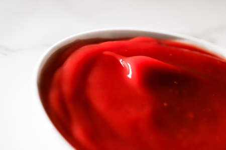 Organic ketchup, tomato sauce closeup, food background and homemade recipesの写真素材