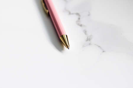 Pink pen on marble background, luxury stationery and business brandingの写真素材