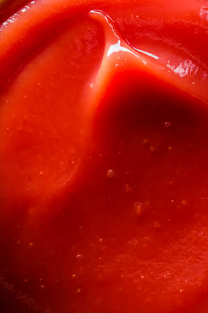 Organic ketchup, tomato sauce closeup, food background and homemade recipes