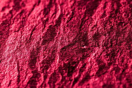 Red stone texture as abstract background, design material and textured surfaces