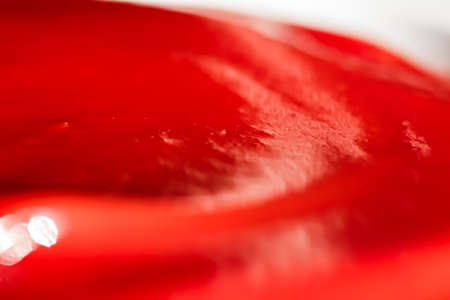 Organic ketchup, tomato sauce closeup, food background and homemade recipes
