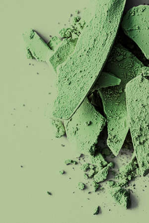 Green eye shadow powder as makeup palette closeup, crushed cosmetics and beauty texturesの写真素材