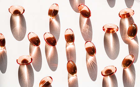 Orange herbal capsules for healthy diet nutrition, pharma brand store, probiotic drug pills as healthcare or supplement products for pharmaceutical industry adsの写真素材