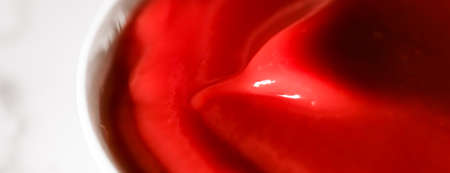 Organic ketchup, tomato sauce closeup, food background and homemade recipes