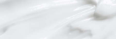 Pure white cream texture as abstract background, food substance or organic cosmetics