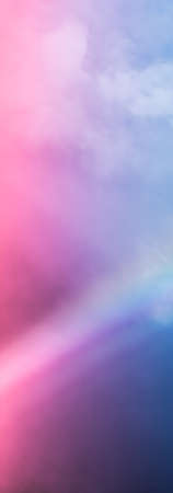 Rainbow in fantasy pink and blue sky, spiritual and nature backgroundsの写真素材