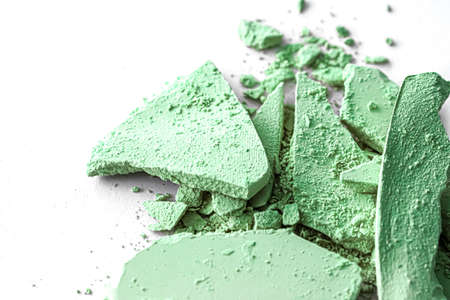 Green eye shadow powder as makeup palette closeup isolated on white background, crushed cosmetics and beauty texturesの写真素材