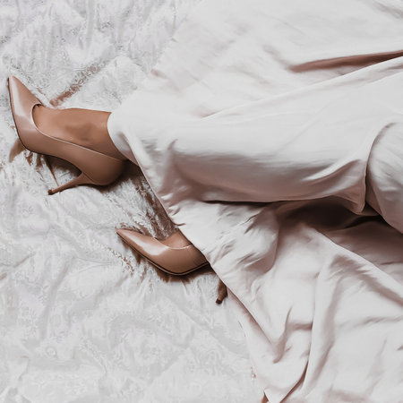 Womans legs in beige high-heels shoes and long silk dress, fashion and luxury lifestyle conceptの写真素材