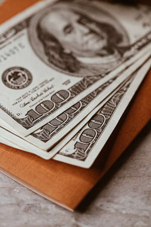 Money on home office desk, american dollars closeupの写真素材