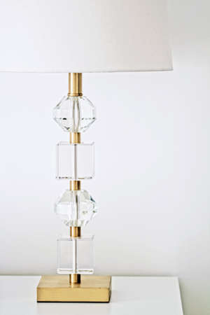 Lamp with gold and crystal design in white interior, luxury home decor conceptの写真素材