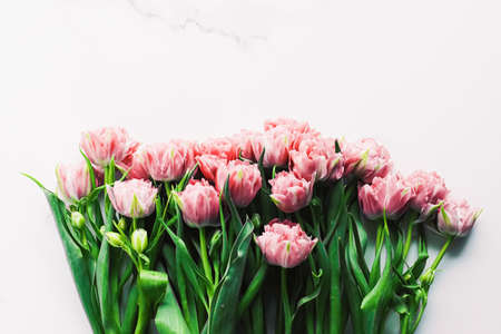 Spring flowers on marble background as holiday gift and floral flatlay conceptの写真素材