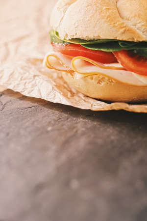 Sandwich with ham, cheese and fresh greens, take out comfort food closeupの写真素材
