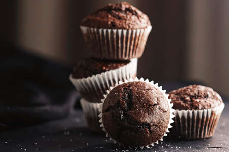 Homemade chocolate muffins, baked comfort food recipe conceptの写真素材