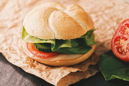 Sandwich with ham, cheese and fresh greens, take out comfort food closeupの写真素材