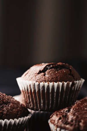 Homemade chocolate muffins, baked comfort food recipe conceptの写真素材