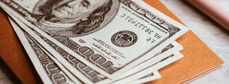 Money on home office desk, american dollarsの写真素材