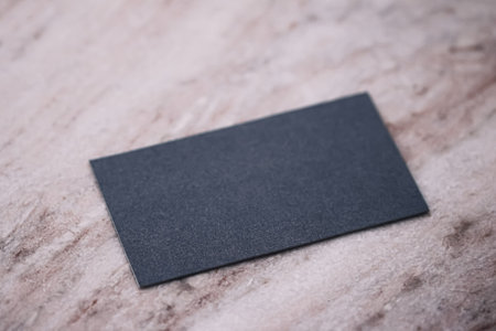 Black business card flatlay on stone background, luxury branding flat lay and brand identity design...