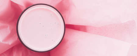 Strawberry milk inside pink paper packaging as sweet drink, food service flat lay and meal deliveryの写真素材