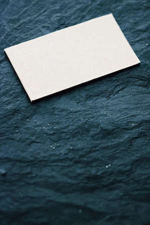 White business card flatlay on dark stone background, luxury branding flat lay and brand identity design for mockupの写真素材
