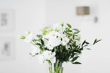 Bouquet of flowers in vase and home decor details, luxury interior designの写真素材