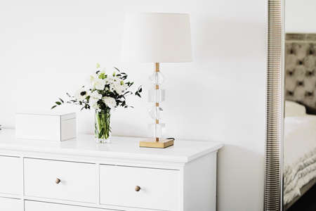 Bouquet of flowers in vase and home decor details, luxury interior designの写真素材