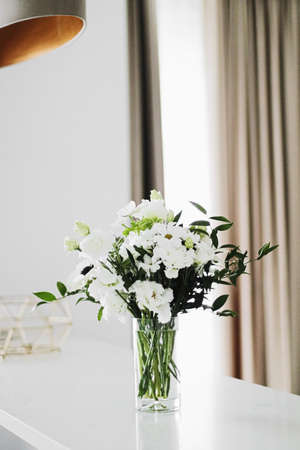 Bouquet of flowers in vase and home decor details, luxury interior designの写真素材