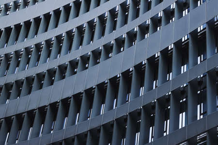 Corporate office building in financial district, modern skyscraper in city downtown, commercial real...