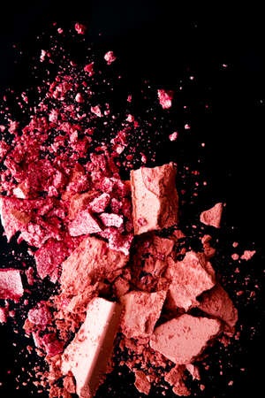 Crushed cosmetics, mineral organic eyeshadow, blush and cosmetic powder isolated on black background, makeup and beauty banner, flatlay designの写真素材