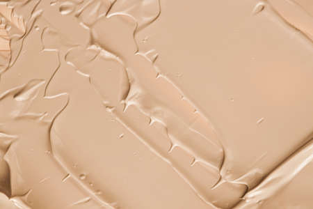 Beige cosmetic texture background, make-up and skincare cosmetics product, cream, lipstick, foundation macro as luxury beauty brand, holiday flatlay designの写真素材