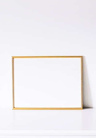 Golden frame on white furniture, luxury home decor and design for mockup, poster print and printable art, online shop showcaseの写真素材