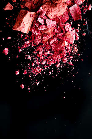 Crushed cosmetics, mineral organic eyeshadow, blush and cosmetic powder isolated on black background, makeup and beauty banner, flatlay designの写真素材