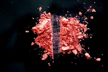 Crushed cosmetics, mineral organic eyeshadow, blush and cosmetic powder isolated on black background, makeup and beauty banner, flatlay designの写真素材