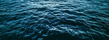 Deep blue ocean water texture, dark sea waves background as nature and environmental designの写真素材