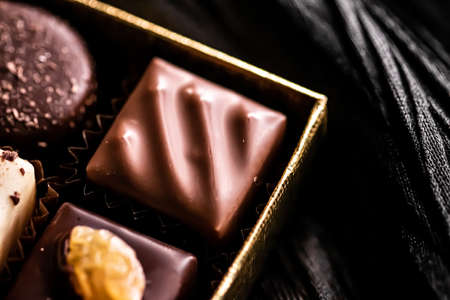 Swiss chocolates in gift box, various luxury pralines made of dark and milk organic chocolate in chocolaterie in Switzerland, sweet dessert food as holiday present and premium confectionery brandの写真素材