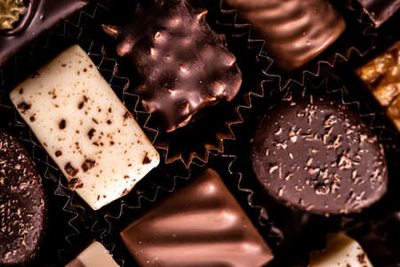 Swiss chocolates in gift box, various luxury pralines made of dark and milk organic chocolate in chocolaterie in Switzerland, sweet dessert food as holiday present and premium confectionery brandの写真素材