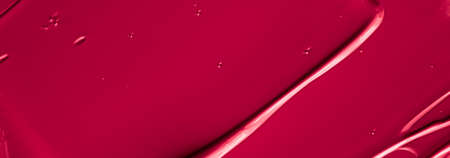 Red lipstick or lip gloss texture as cosmetic background, makeup and beauty cosmetics product for luxury brand, holiday flatlay backdrop or abstract wall art and paint strokesの写真素材