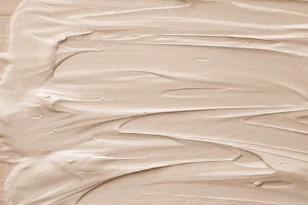 Beige cosmetic texture background, make-up and skincare cosmetics product, cream, lipstick, foundation macro as luxury beauty brand, holiday flatlay designの写真素材