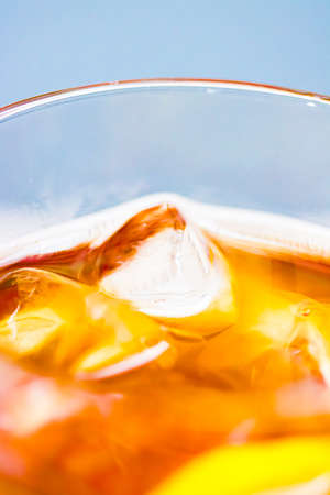 Ice tea with lemon in glass as cold fresh drink outdoors, summer cocktail or sweet fruit soda...