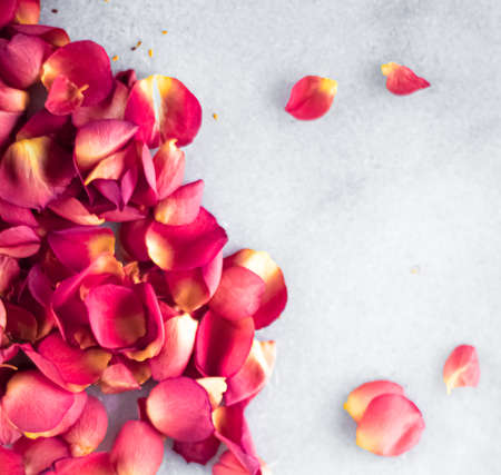Rose petals on marble background, floral decor and wedding flatlay, holiday greeting card backdrop for event invitation, flat lay designの写真素材