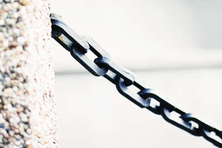 Metal chain closeup, marine background