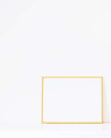 Golden frame on white furniture, luxury home decor and design for mockup, poster print and printable art, online shop showcaseの写真素材